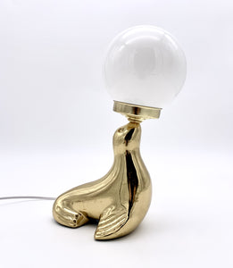 Vintage brass sea lion lamp
